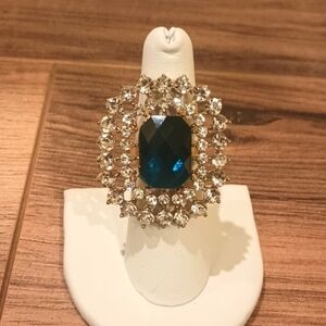 Large costume rhinestone ring with adjustable band in good used condition